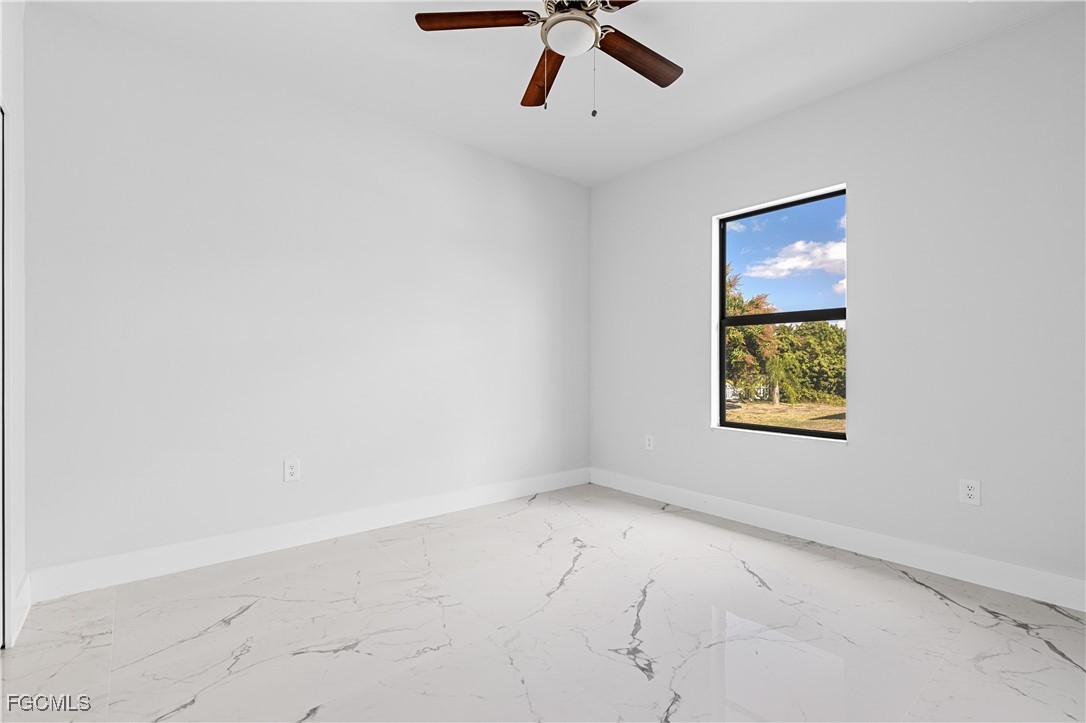 3728 9th Street West Lehigh Acres, FL 33971 - Photo 24 of 35 an empty room with a window