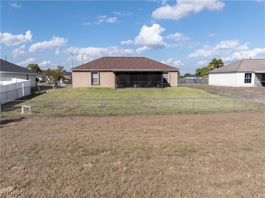 3728 9th Street West Lehigh Acres, FL 33971 - Photo 28 of 35 a view of a house with a yard