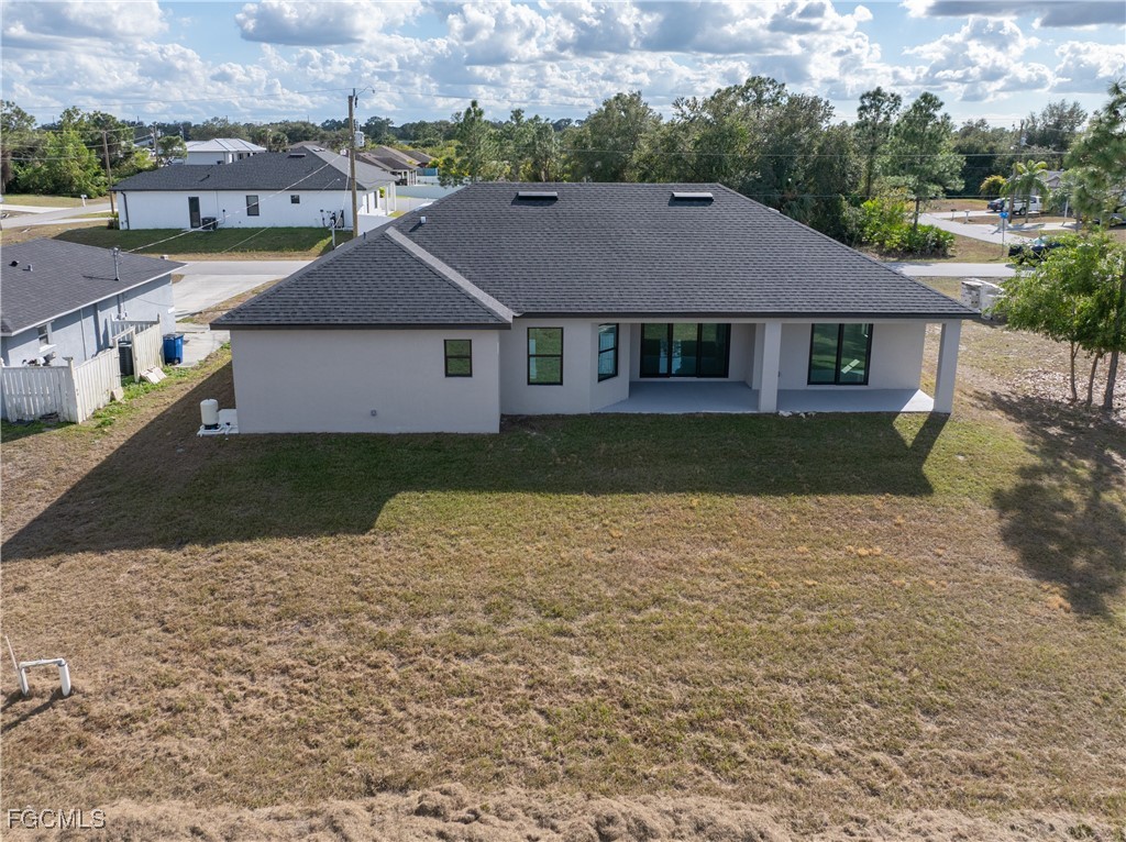 3728 9th Street West Lehigh Acres, FL 33971 - Photo 33 of 35 an aerial view of a house