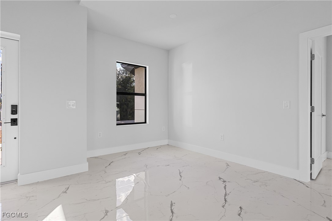 3728 9th Street West Lehigh Acres, FL 33971 - Photo 6 of 35 an empty room with windows