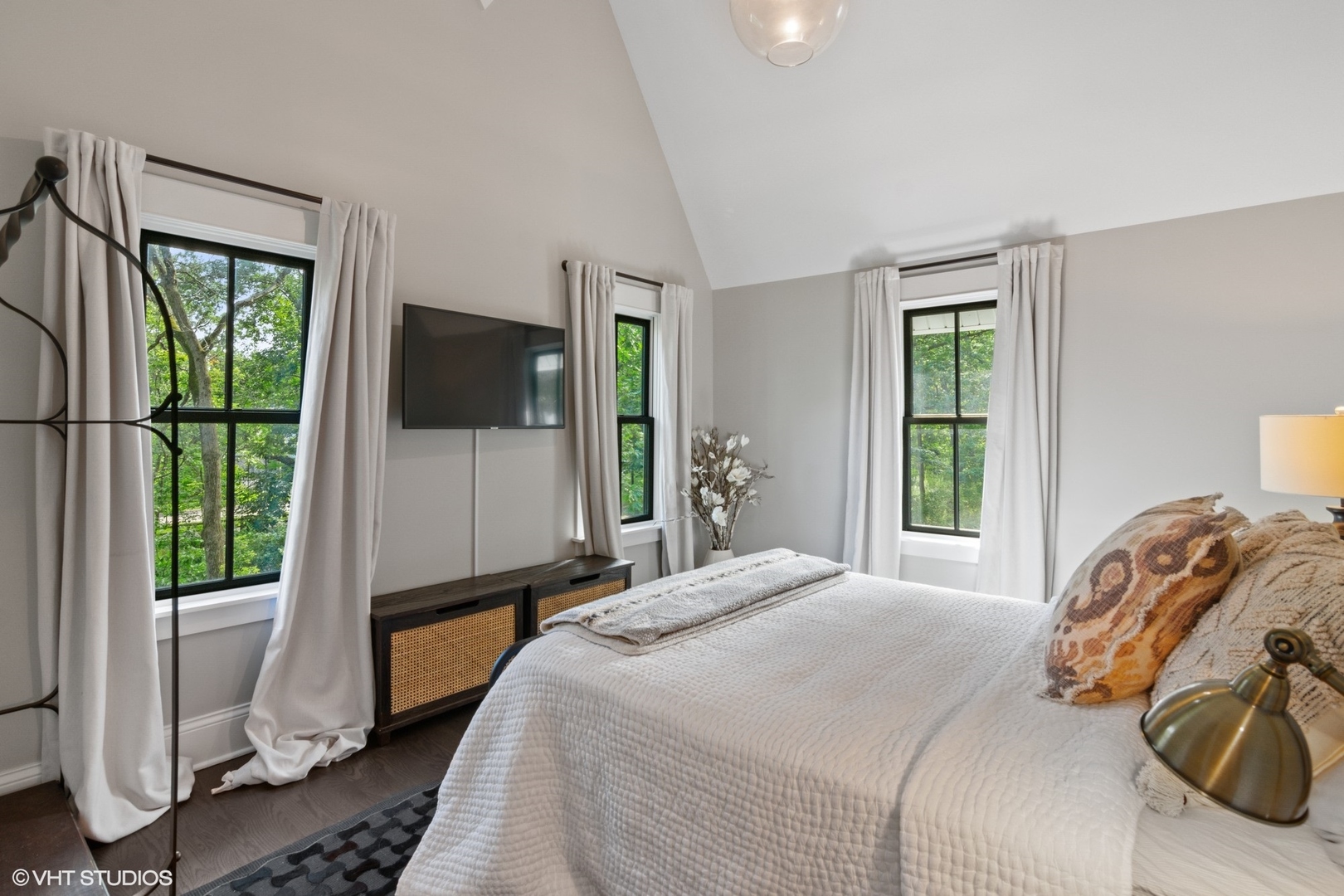 735 Baldwin Road Highland Park, IL 60035 - Photo 16 of 30 a bedroom with a bed and a flat tv screen next to a window