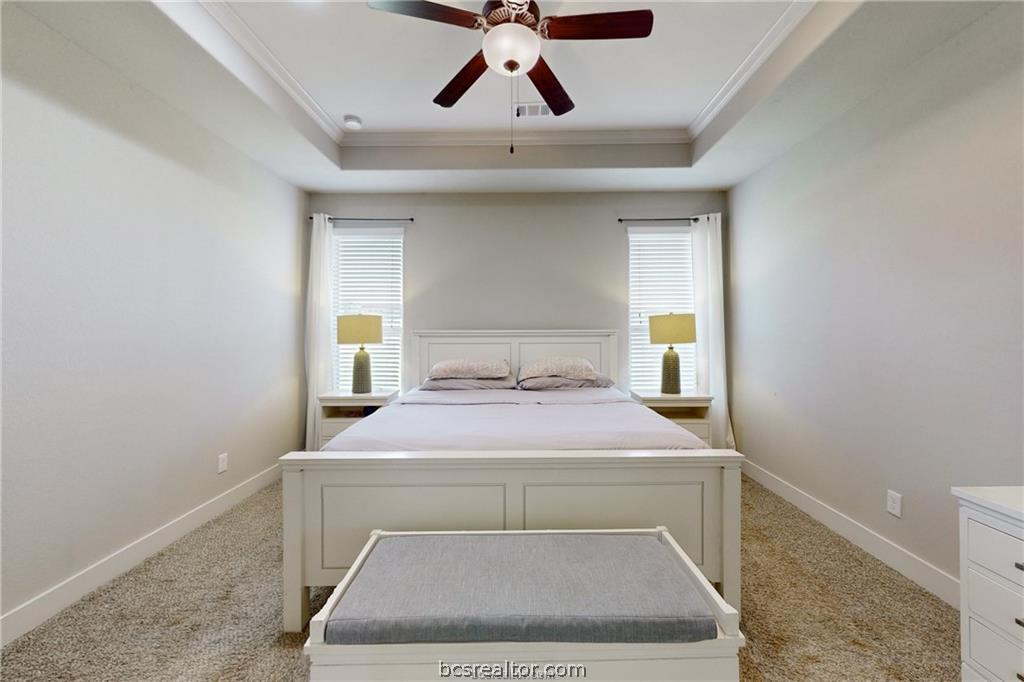 3007 Embers Loop Bryan, TX 77808 - Photo 13 of 27 Primary bedroom with raised ceiling detail
