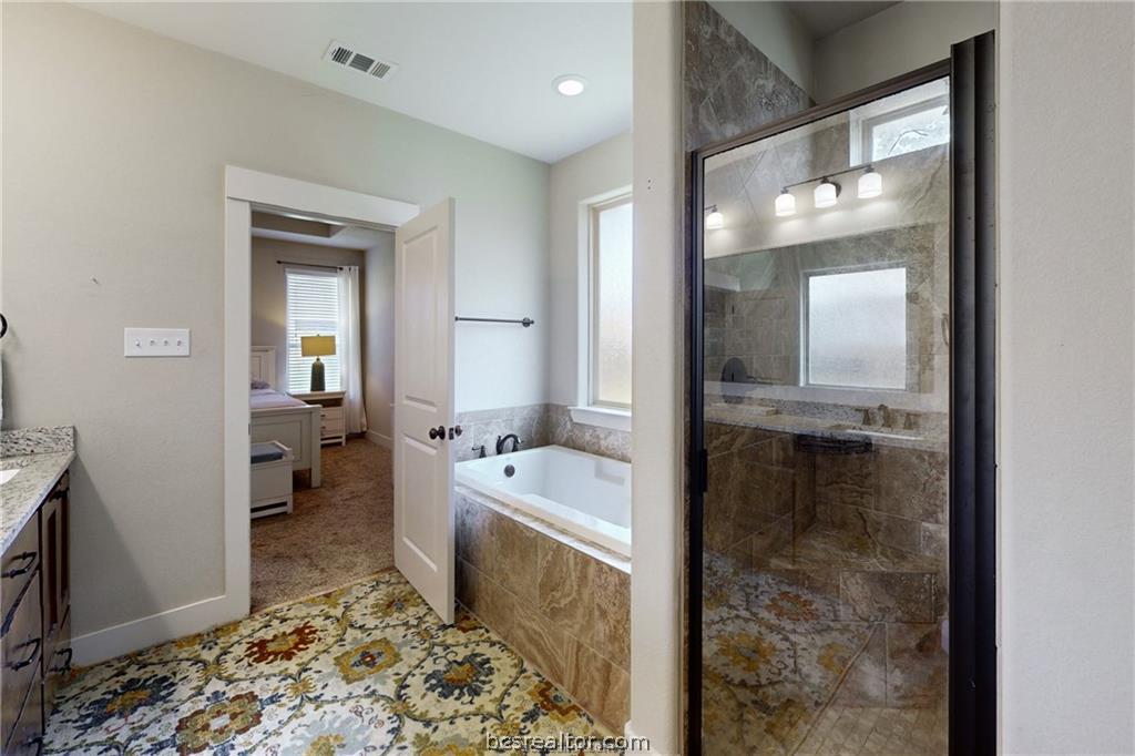 3007 Embers Loop Bryan, TX 77808 - Photo 15 of 27 Primary bath with soaking tub and separate shower