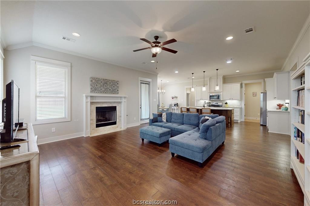 3007 Embers Loop Bryan, TX 77808 - Photo 2 of 27 Living area anchored by fireplace
