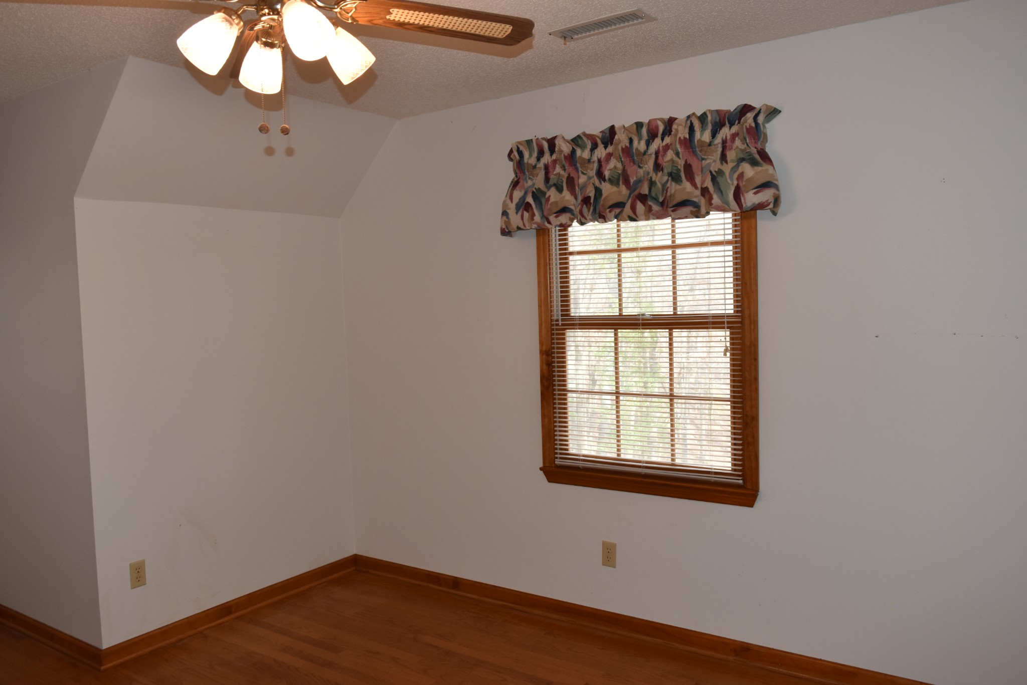 1454 Stagecoach Road Sewanee, TN 37375 - Photo 42 of 71 an empty room with wooden floor fan and windows