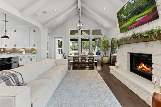 a living room with furniture fireplace and window