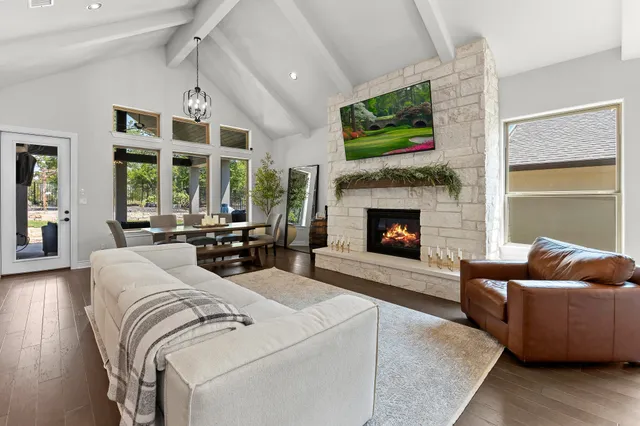 a living room with furniture fireplace and window