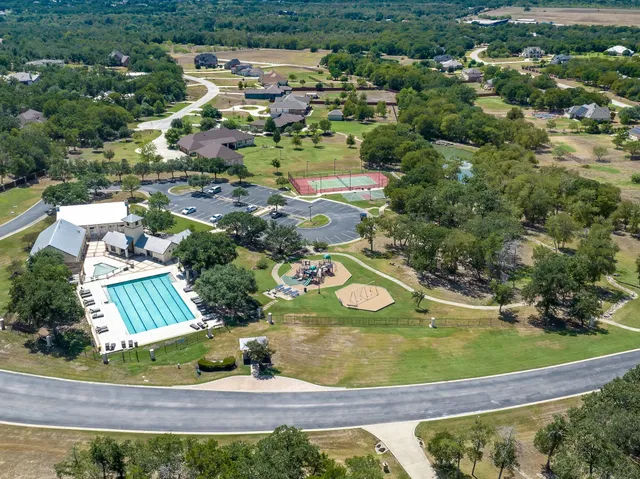 aerial view of a house with a yard
