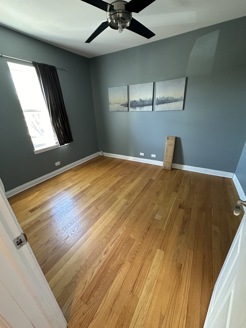 56 Forest Avenue, Unit 3N Riverside, IL 60546 - Photo 5 of 12 a view of a big room with wooden floor and windows