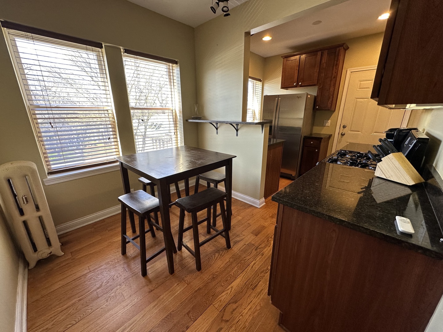 56 Forest Avenue, Unit 3N Riverside, IL 60546 - Photo 8 of 12 a dining room with furniture and wooden floor