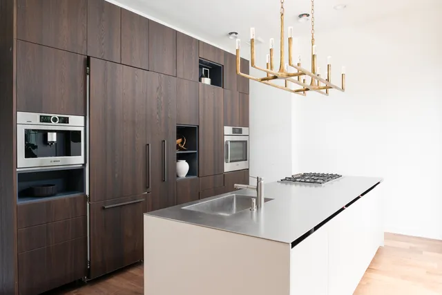 a bathroom with a sink a mirror and shower