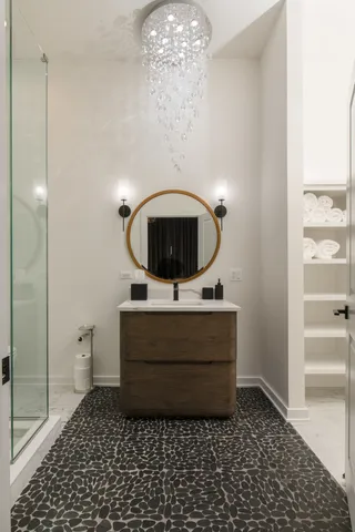 a living room with furniture and a chandelier