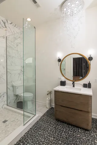 a view of living room with furniture and wooden floor