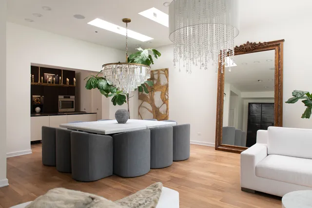 a view of a kitchen with a sink and wooden floor