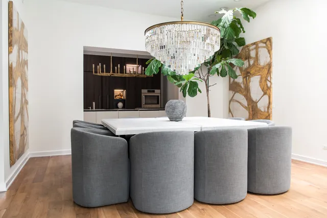 a room with granite countertop a sink and a wooden floor