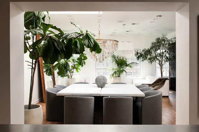 a kitchen with stainless steel appliances granite countertop a sink and a refrigerator