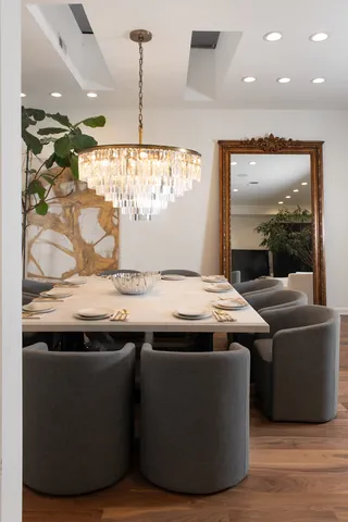 a kitchen with stainless steel appliances granite countertop a sink and a refrigerator