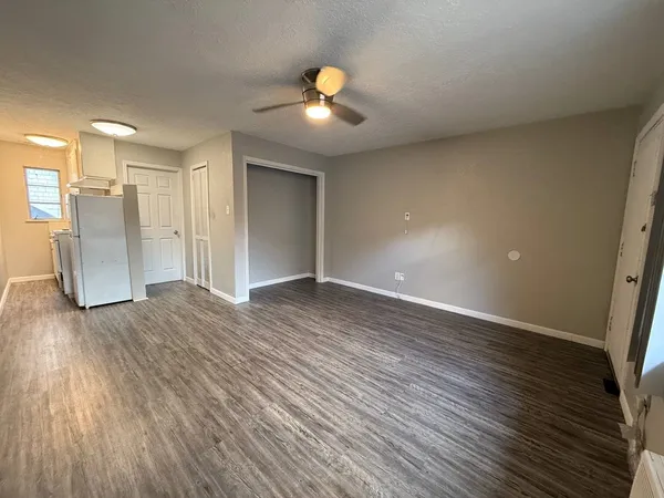 a view of a livingroom with wooden floor