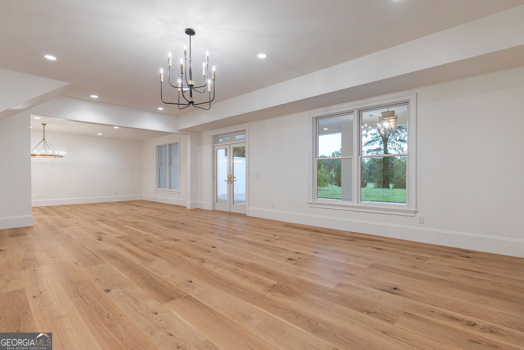 1321 Garrett Road Statham, GA 30666 - Photo 68 of 161 a view of an empty room with wooden floor and a window