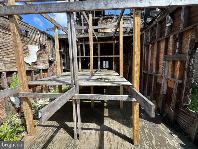 a view of a balcony with wooden floor