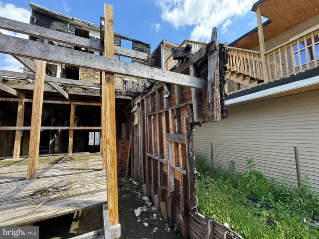 a view of a chairs and table in a patio