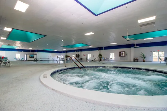 a living room with lots of furniture and white walls