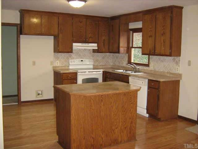 1108 Bahama Road Bahama, NC 27503 - Photo 3 of 10 WOW! THE KITCHEN FEATURES '5 HARDWOOD FLOORING, NEW BACKSPLASH, COUNTERTOPS, NEW APPLIANCES, FRESH PAINT & NEW LIGHTING. Other