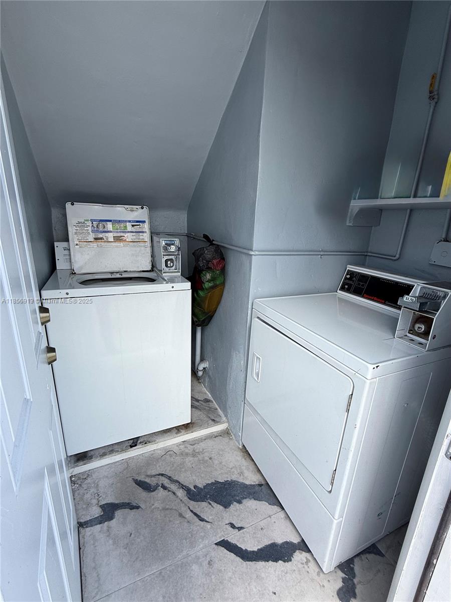 852 Southwest 1st Street, Unit 4 Miami, FL 33130 - Photo 16 of 17 a utility room with dryer and washer
