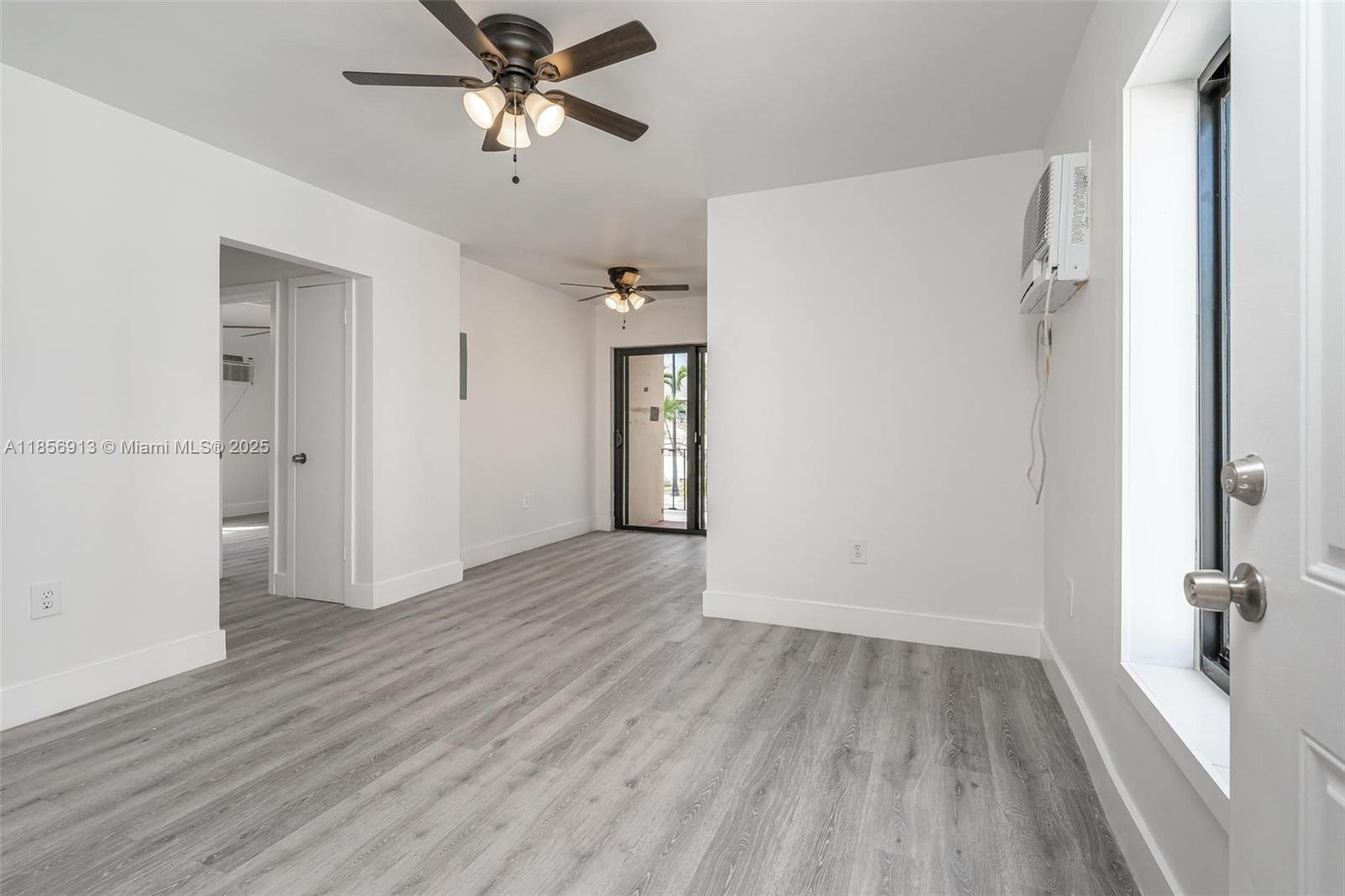 852 Southwest 1st Street, Unit 4 Miami, FL 33130 - Photo 2 of 17 wooden floor in an empty room
