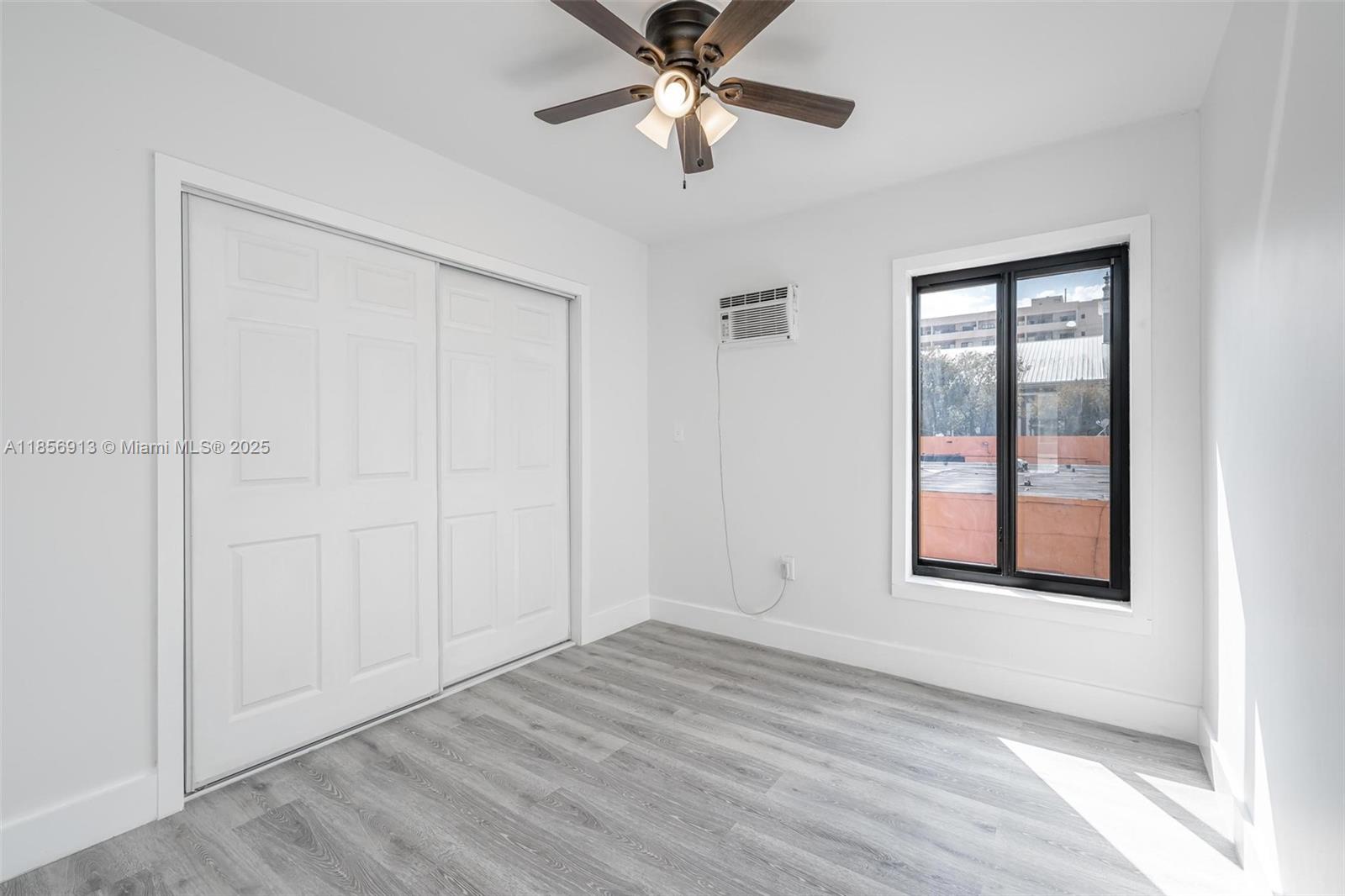 852 Southwest 1st Street, Unit 4 Miami, FL 33130 - Photo 9 of 17 a view of an empty room with a window