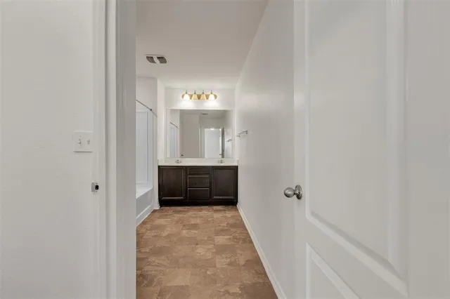 a view of a bedroom from the hallway