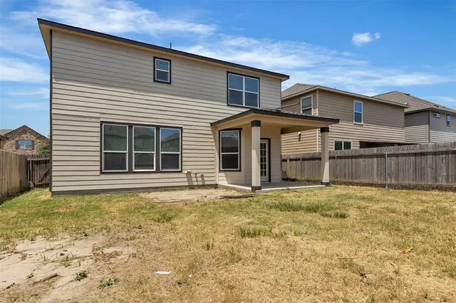 a front view of a house with a large window