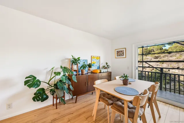 a view of a dining room with furniture window and wooden floor