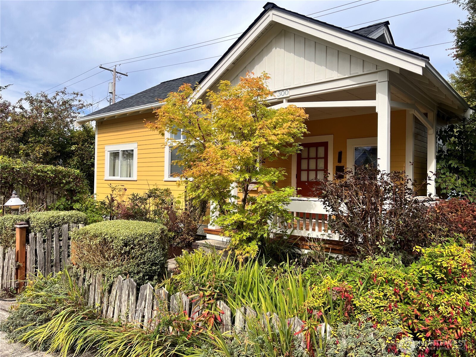 a view of a house with a flower garden
