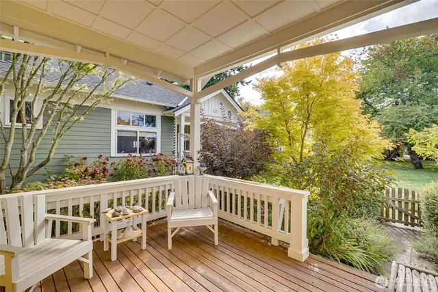 a view of a chair and table on the deck