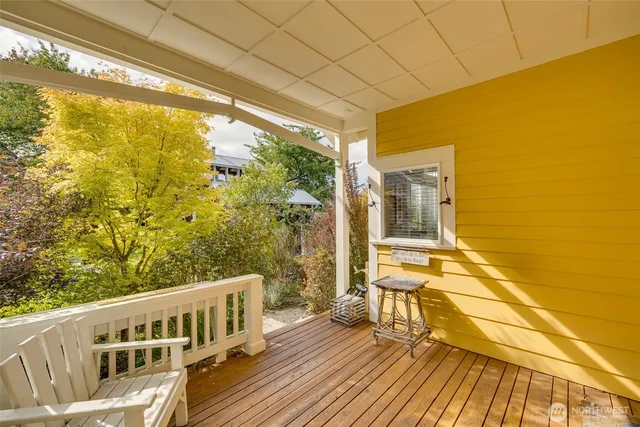 a view of balcony with wooden floor