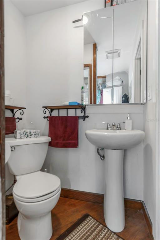 17500 Marsh Road Lutz, FL 33558 - Photo 12 of 80 a bathroom with a sink toilet and a mirror