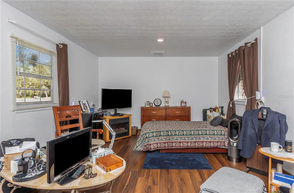 17500 Marsh Road Lutz, FL 33558 - Photo 14 of 80 a living room with furniture and a flat screen tv