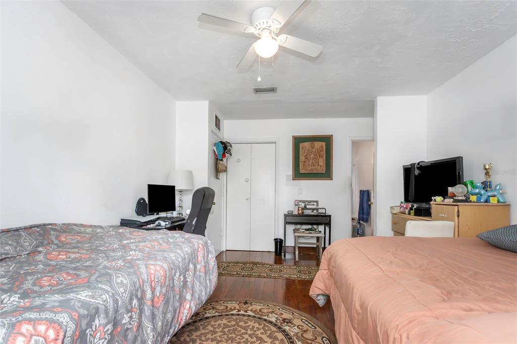 17500 Marsh Road Lutz, FL 33558 - Photo 15 of 80 a bedroom with a bed and a flat screen tv