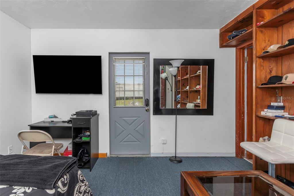 17500 Marsh Road Lutz, FL 33558 - Photo 28 of 80 a living room with furniture and a flat screen tv
