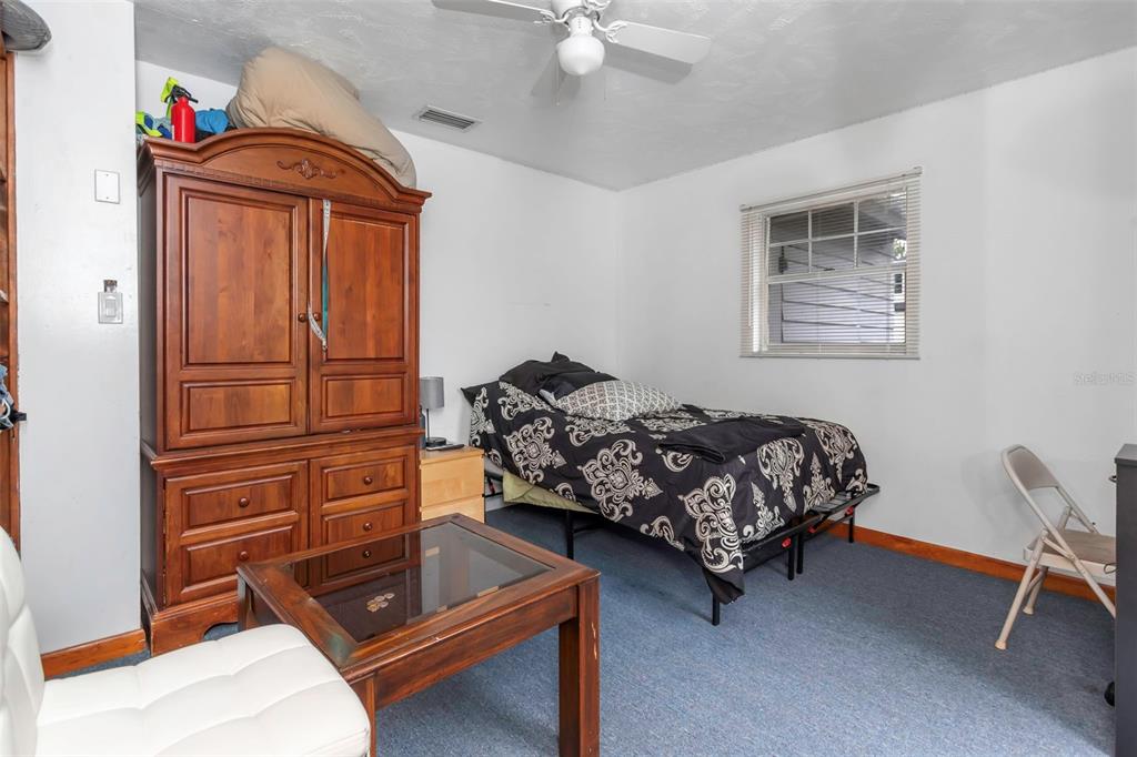 17500 Marsh Road Lutz, FL 33558 - Photo 30 of 80 a bedroom with a bed and furniture