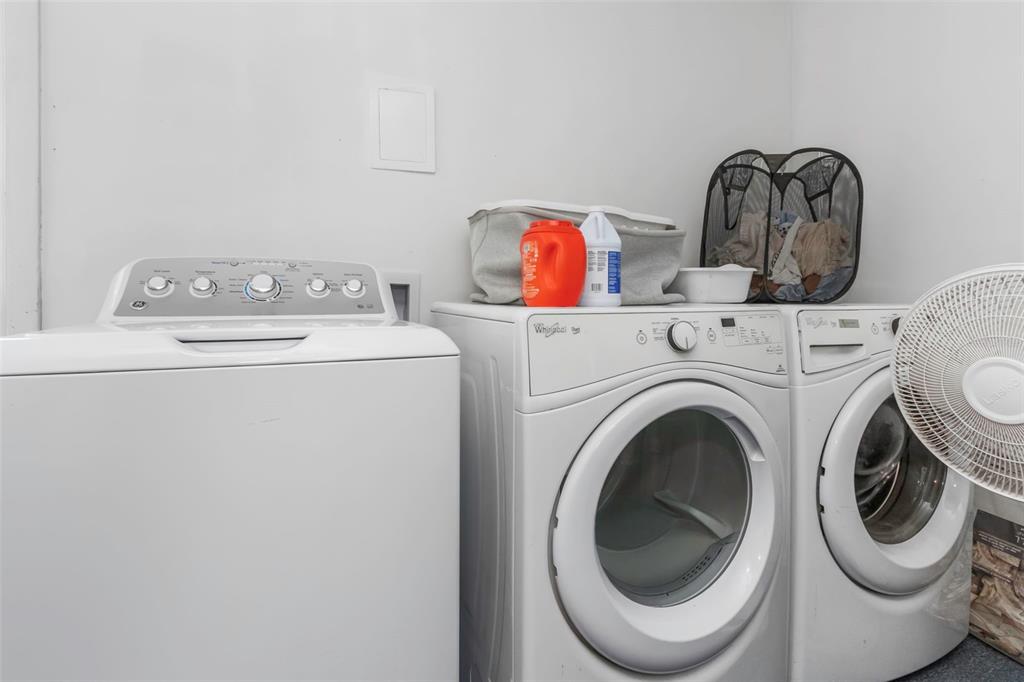 17500 Marsh Road Lutz, FL 33558 - Photo 34 of 80 a utility room with dryer and washer