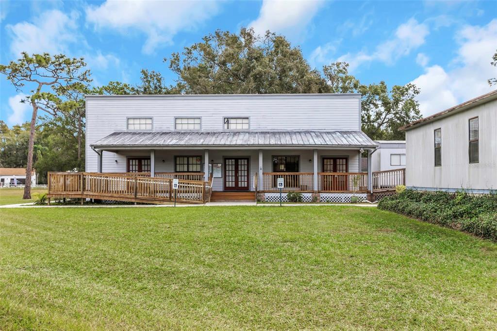 17500 Marsh Road Lutz, FL 33558 - Photo 37 of 80 a front view of a house with swimming pool having outdoor seating