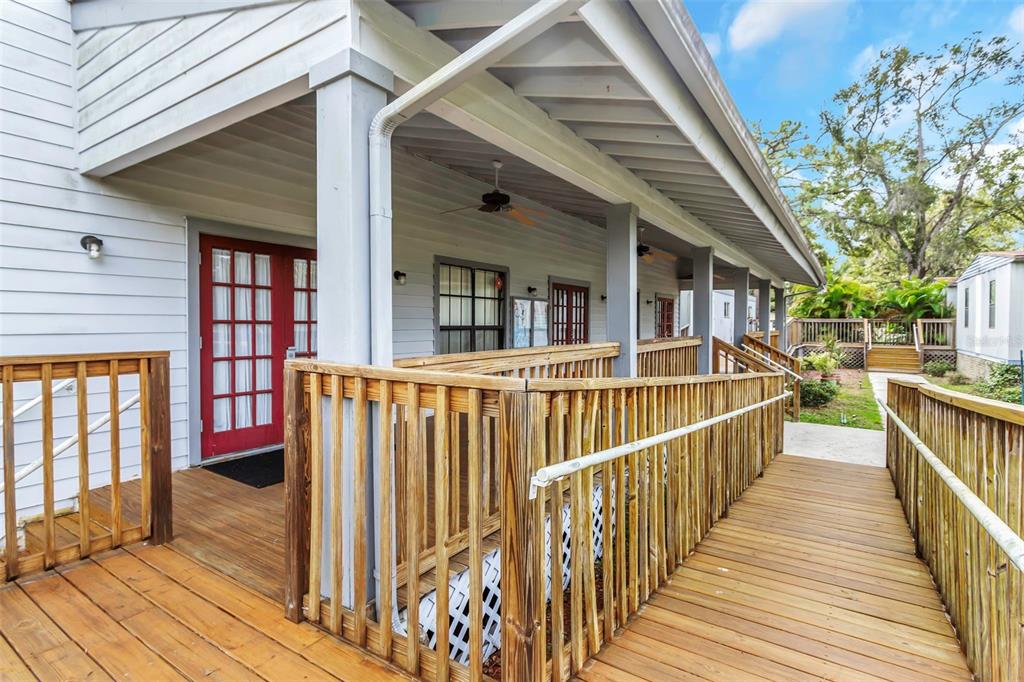 17500 Marsh Road Lutz, FL 33558 - Photo 38 of 80 a view of a balcony with wooden floor and stairs