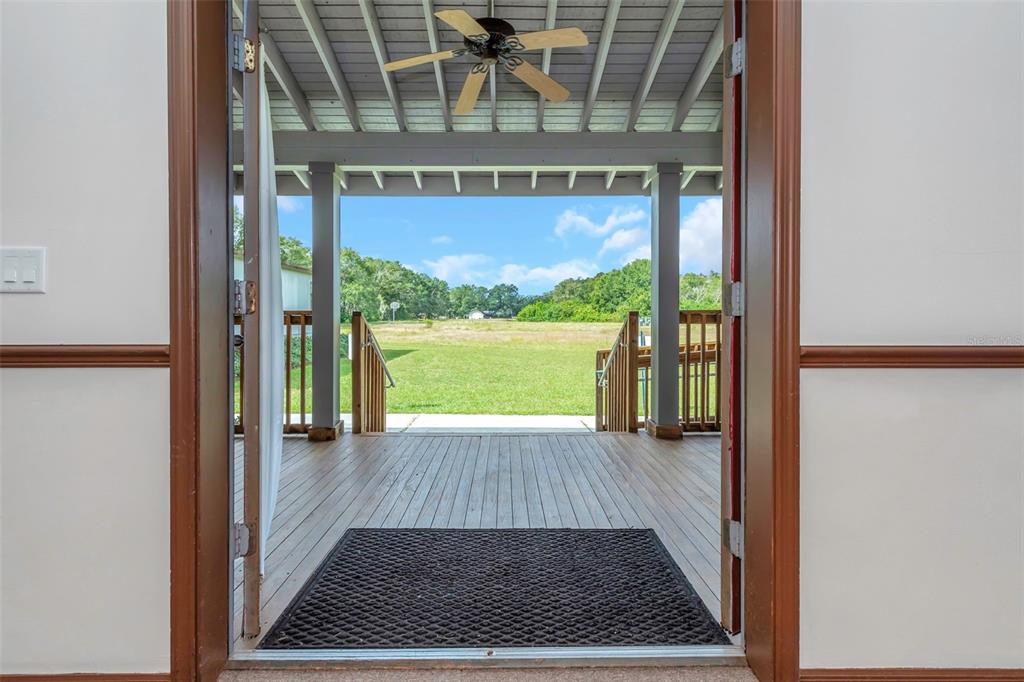 17500 Marsh Road Lutz, FL 33558 - Photo 43 of 80 a view of a glass door with wooden floor