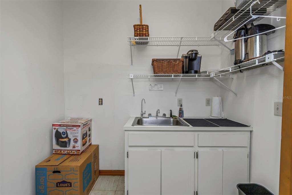 17500 Marsh Road Lutz, FL 33558 - Photo 50 of 80 a kitchen with stainless steel appliances granite countertop a sink and cabinets