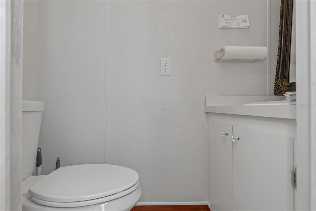 17500 Marsh Road Lutz, FL 33558 - Photo 59 of 80 a white toilet sitting next to a bathroom sink
