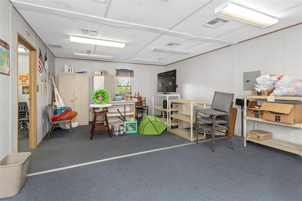 17500 Marsh Road Lutz, FL 33558 - Photo 70 of 80 a living room with furniture and a lamp