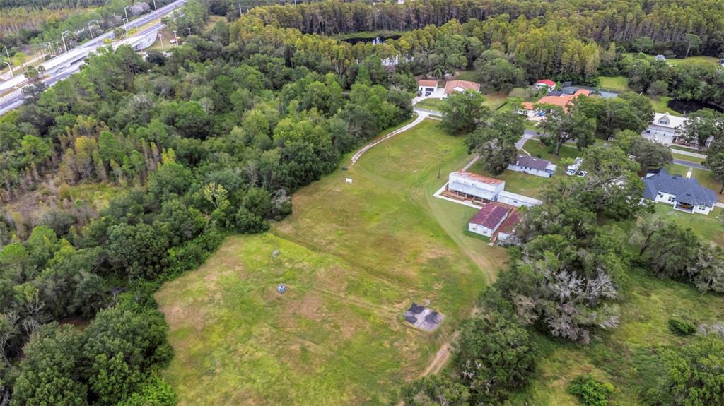 17500 Marsh Road Lutz, FL 33558 - Photo 7 of 80 an aerial view of residential house with outdoor space and swimming pool