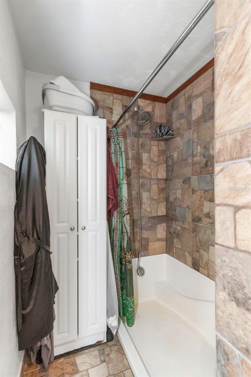 17500 Marsh Road Lutz, FL 33558 - Photo 10 of 80 a bathroom with a shower and a tub